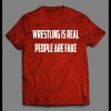 WRESTLING IS REAL PEOPLE ARE FAKE PRO WRESTLING SHIRT